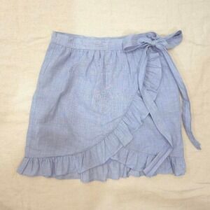 Madewell blue plaid wrap skirt with ruffles and tie waist. Size: 00